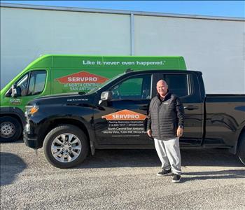 Man standing in front of a SERVPRO truck