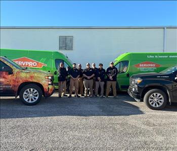 Group of men in front of a SERVPRO truck 